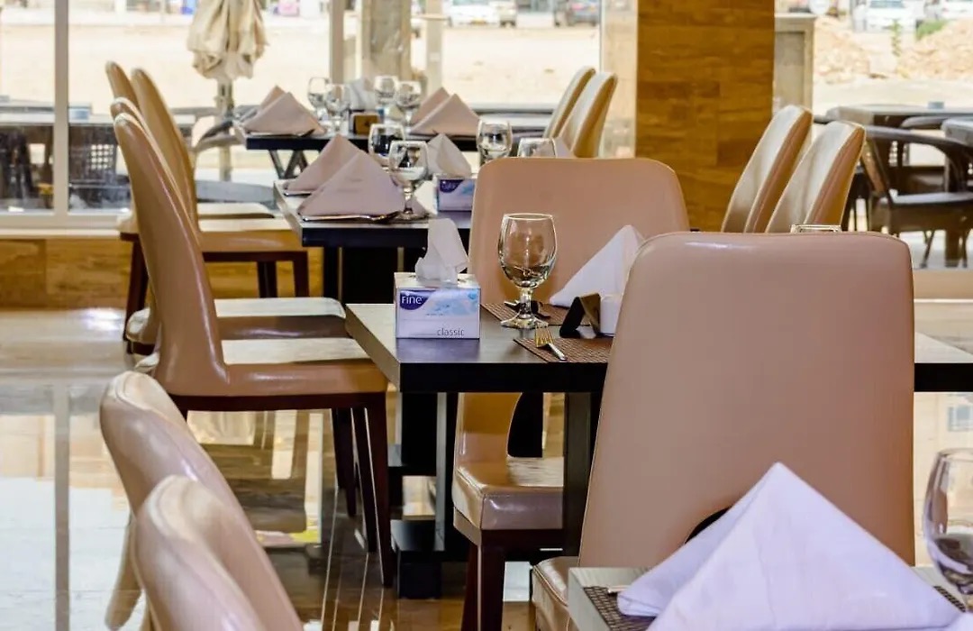 Restaurant tables set for dinner by the window