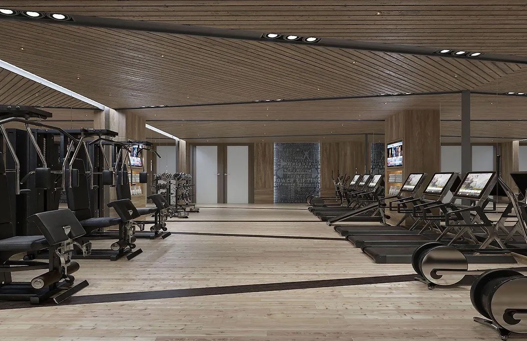 Gym with weight machines and a wooden ceiling