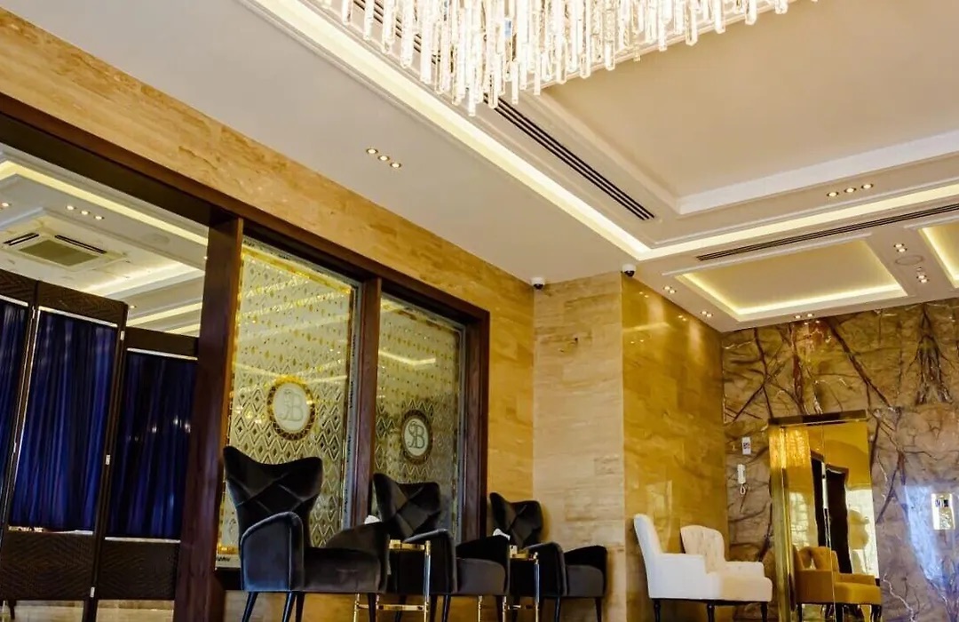 Lobby seating with armchairs and a mirror