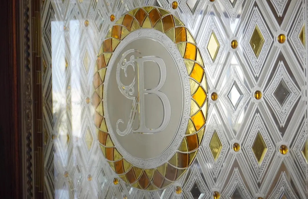 The Bristol B monogram in gold and white on the lobby wall