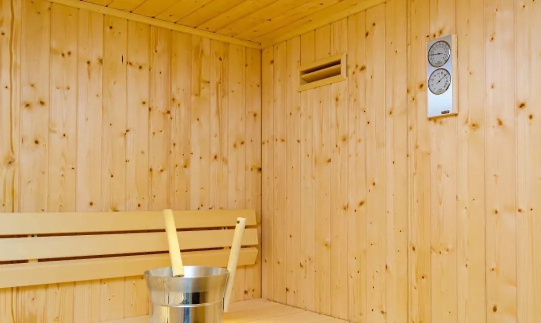 Sauna bench with a wooden bucket